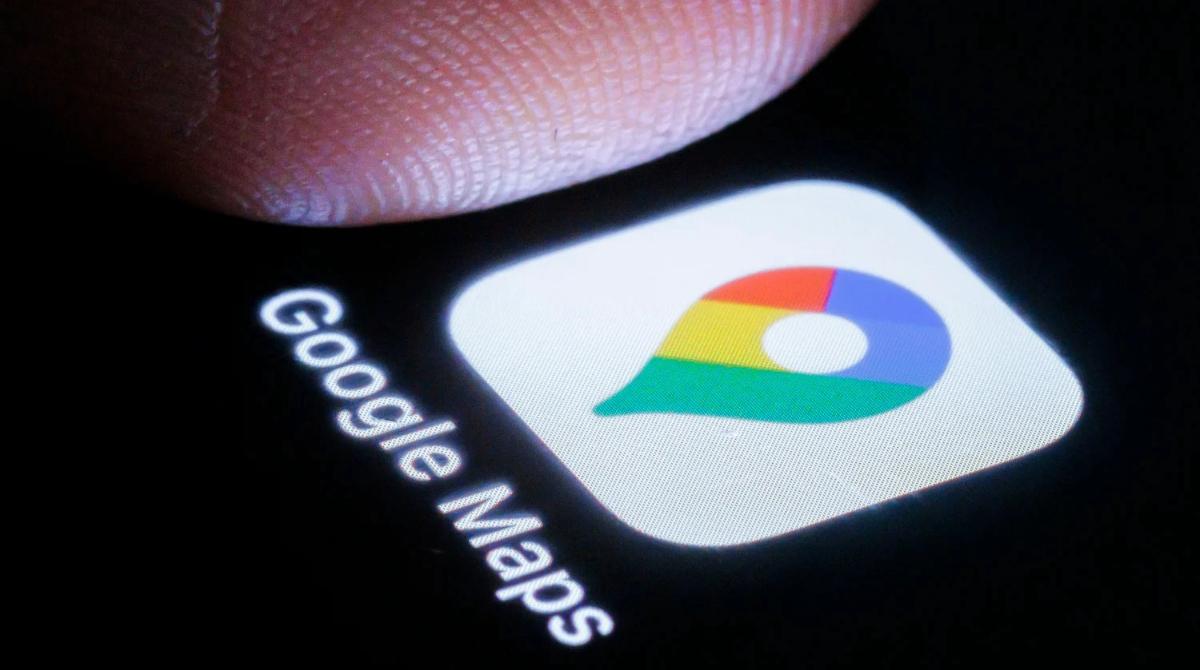 Image of a finger hovering over the Google Maps phone app icon